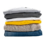 2025 11 18 09 57 14 vertical shot of a stack of folded clothes removebg preview